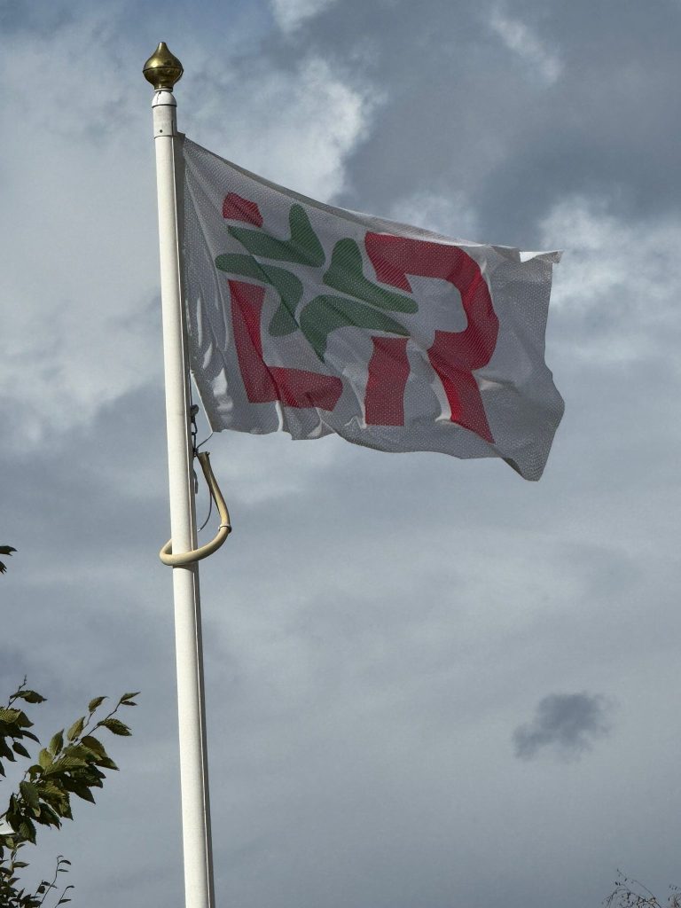 Flag raised to mark 6 months